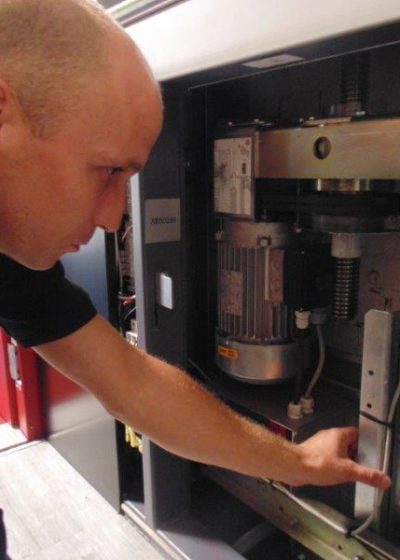 Gartec Service Engineer Examining Platform Lift
