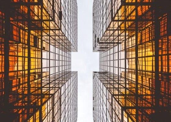 Looking Up Between Glass Buildings